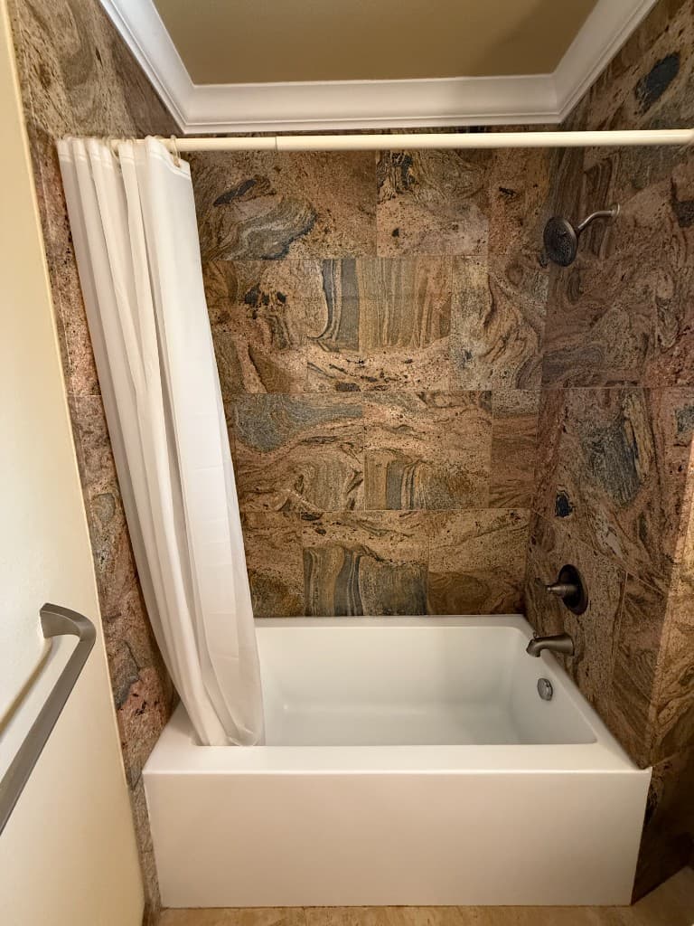 Bathroom remodel — tub and stone tile shower surround